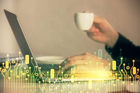 Multi exposure of woman hands working on computer and data theme hologram drawing. Tech concept.