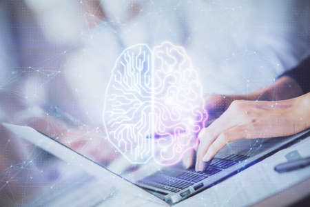 Double exposure of woman hands working on computer and brain hologram drawing. Ai concept.