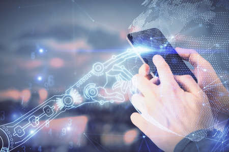 Double exposure of man's hands holding and using a digital device and tech theme hologram drawing....