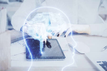 Double exposure of brain sketch hologram and woman holding and using a mobile device.