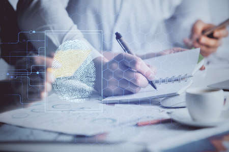 Double exposure of fingerprint drawing over people taking notes background. Concept of securityの写真素材