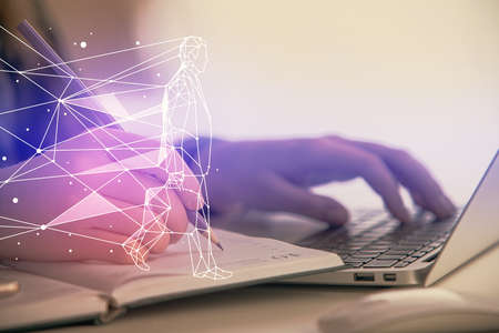 Double exposure of woman hands typing on computer and creative drawing. Start up concept.の写真素材