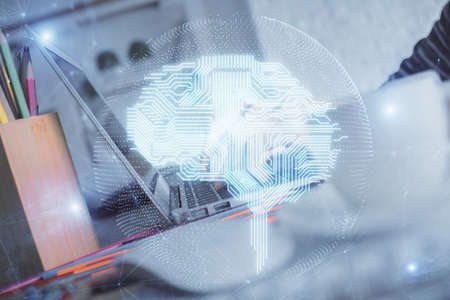 Double exposure of woman hands working on computer and brain hologram drawing. Ai concept.