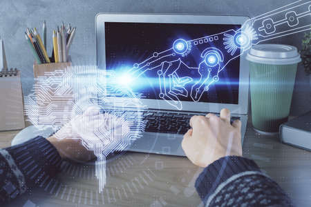 Double exposure of woman hands working on computer and brain hologram drawing. Ai concept.
