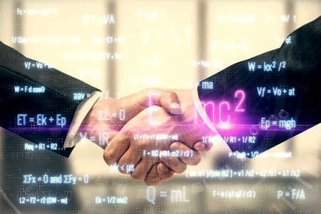 Double exposure of formulas drawings hologram and handshake of two men. Education concept