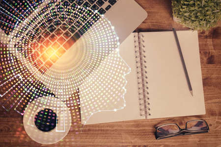 Double exposure of brain drawing hologram over topview work table background with computer. Concept...