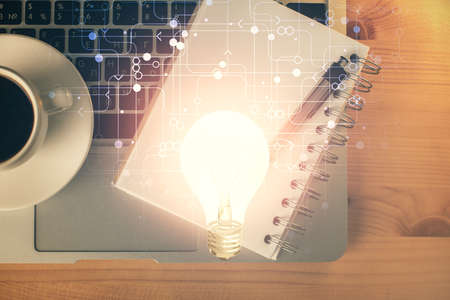 Double exposure of bulb drawing and work table top veiw. Concept of idea.