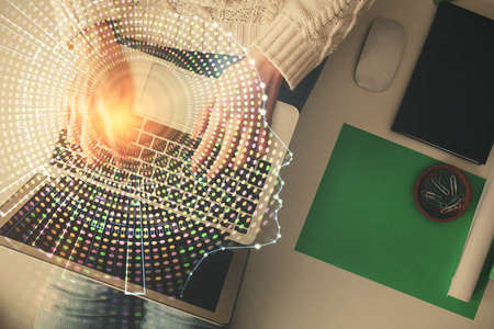 Double exposure of woman working on computer andhuman brain hologram drawing. Top View. Ai concept.