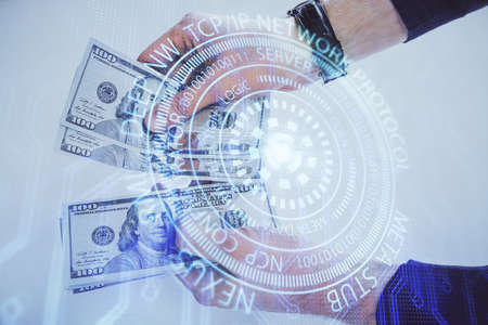 Multi exposure of technology drawing hologram and us dollars bills and man hands. Data conceptの写真素材