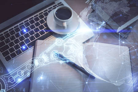 Technology hologram drawing over computer on the desktop background. Top view. Double exposure. Tech...