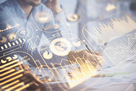 Double exposure of man and woman working together and tech hologram drawing. Technology concept. Computer background.の写真素材