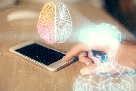 Double exposure of man in vr glasses sketch hologram and woman holding and using a mobile device.の写真素材
