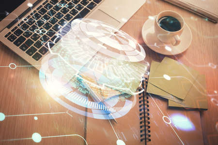 Double exposure of data theme drawing hologram over topview work table background with computer. Concept of technology.の写真素材