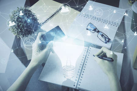Multi exposure of woman on-line shopping holding a credit card and bulb drawing. Choice concept.