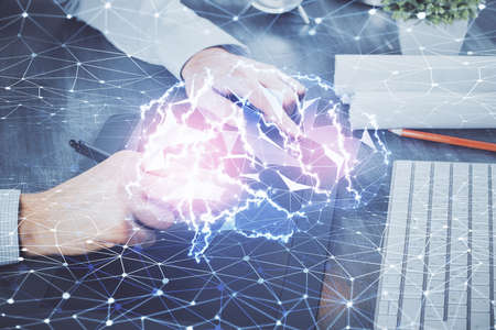 Double exposure of man's hand holding and using a digital device and brain hologram drawing. Data concept.の写真素材