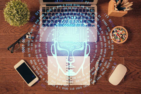 Double exposure of brain drawing hologram over topview work table background with computer. Concept...