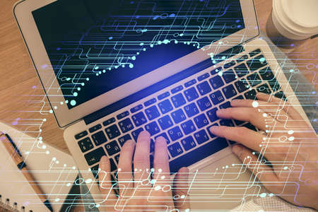 Multi exposure of man's hands typing over computer keyboard and data theme hologram drawing. Top...