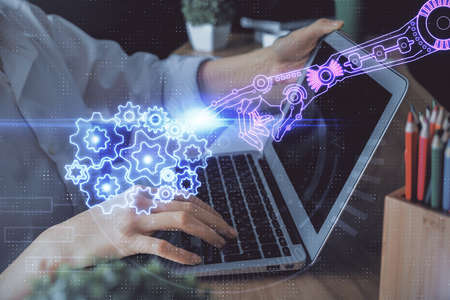 Double exposure of woman hands working on computer and data theme hologram drawing. Tech concept.