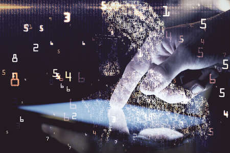 Double exposure of man's hands holding and using a digital device and tech theme hologram drawing....