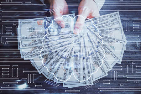 Multi exposure of brain drawing hologram and us dollars bills and man hands. Ai invest conceptの写真素材