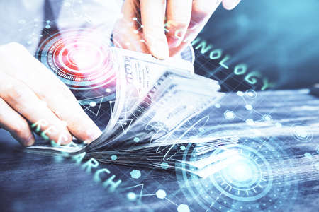 Double exposure of technology drawing hologram and us dollars bills and man hands. Data conceptの写真素材