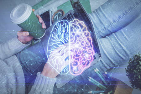 Double exposure of woman hands working on computer and brain hologram drawing. Ai concept.の写真素材