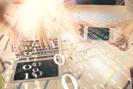 Double exposure of man and woman working together and data theme hologram drawing. Computer...