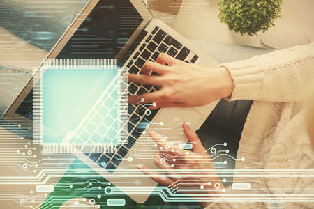 Double exposure of woman hands working on computer and data theme hologram drawing. Top View....