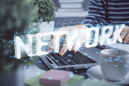 Double exposure of woman hands working on computer and data theme hologram drawing. Tech concept.の写真素材