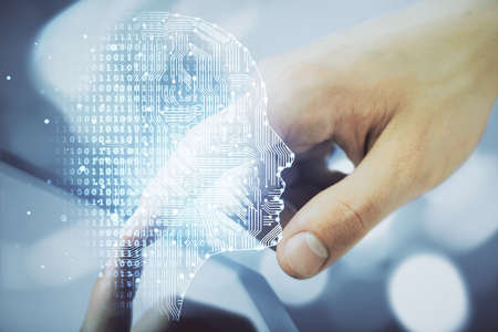 Double exposure of man's hand holding and using a digital device and brain hologram drawing. Data concept.の写真素材