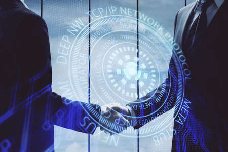 Double exposure of data theme hologram and handshake of two men. Partnership in IT industry concept.