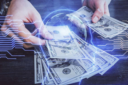 Multi exposure of brain drawing hologram and us dollars bills and man hands. Ai invest conceptの写真素材