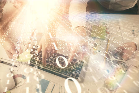 Double exposure of man and woman working together and data theme hologram drawing. Computer background. Top View.の写真素材