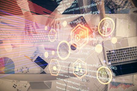 Double exposure of man and woman working together and data theme hologram drawing. Computer...