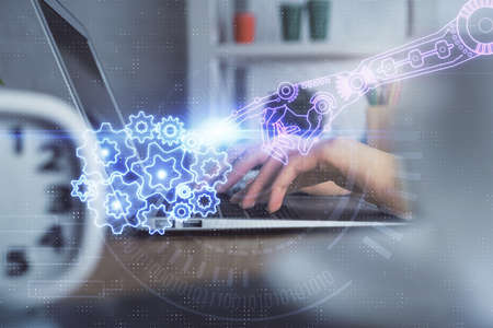 Double exposure of woman hands working on computer and data theme hologram drawing. Tech concept.