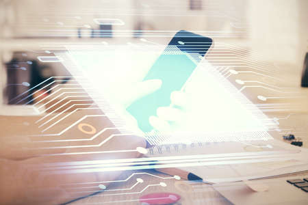 Double exposure of man's hand holding and using a digital device and data theme drawing. Technology concept.の写真素材