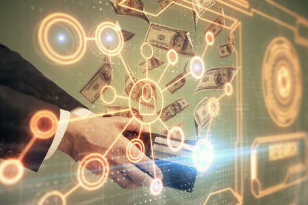 Multi exposure of social network theme drawing hologram and USA dollars bills and man hands.の写真素材