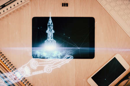 Multi exposure of creative drawing over table with phone. Top view. Concept of startup.の写真素材
