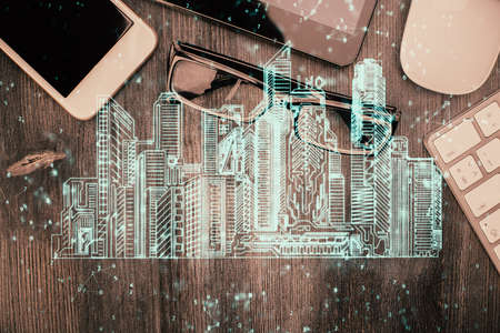 Multi exposure of smart city technology drawing over table with phone. Top view.の写真素材
