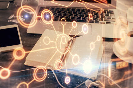 Double exposure of social network theme drawings and desk with open notebook background. Concept of...