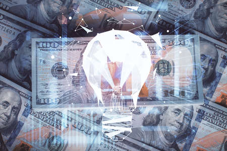 Double exposure of light bulb drawing over usa dollars bill background. Concept of idea.の写真素材