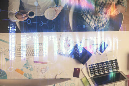 Double exposure of man and woman working together and data theme hologram drawing. Computer...