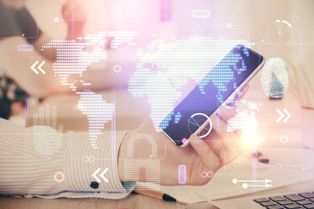 Multi exposure of man's hands holding and using a digital device and map drawing. International business concept.の写真素材