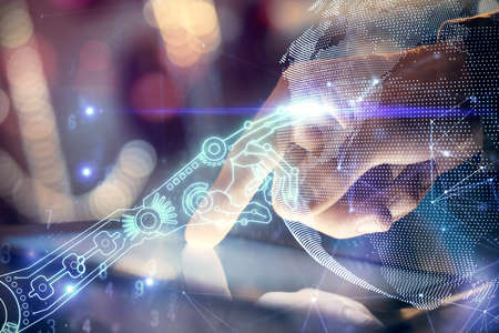 Double exposure of man's hands holding and using a digital device and tech theme hologram drawing. Technology concept.の写真素材