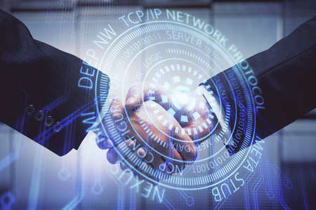 Double exposure of data theme hologram and handshake of two men. Partnership in IT industry concept.