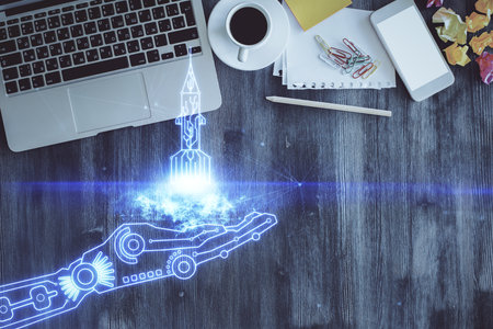 Start up theme drawing over computer on the desktop background. Top view. Double exposure. Brainstorm concept.の写真素材