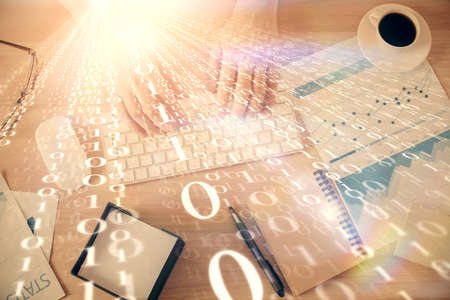 Double exposure of man's hands typing over computer keyboard and data theme hologram drawing. Top...