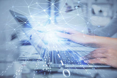 Multi exposure of woman hands working on computer and data theme hologram drawing. Tech concept.の写真素材