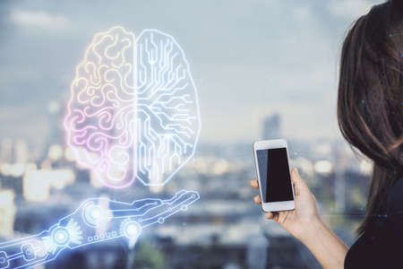Double exposure of brain sketch hologram and woman holding and using a mobile device.