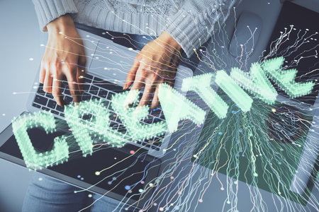 Double exposure of woman hands working on computer and creative hologram drawing. Top View. Start up...